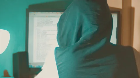 Hacker man programmer in the hood using computer for hack information and data Stock Footage 88327364