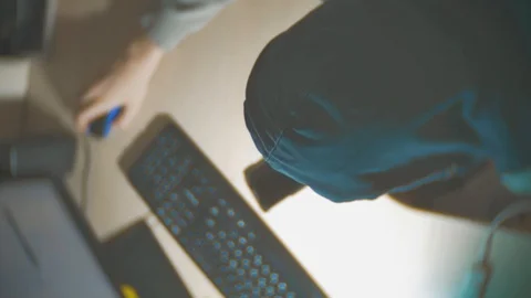 Hacker man programmer in the hood using computer for hack information and data Stock Footage 88560045