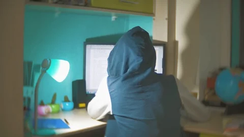 Hacker man programmer in the hood using computer for hack information and data Stock Footage 88564457