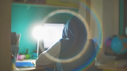 Hacker man programmer in the hood using computer for hack information and data Stock Footage 88720596