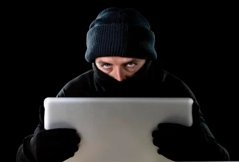 Hacker man using computer laptop for criminal activity hacking password Stock-Fotos