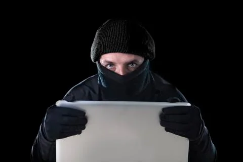 Hacker man using computer laptop for criminal activity hacking password Stock Photos