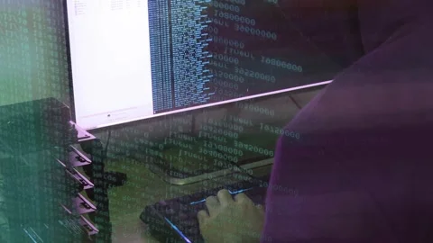 A hacker man writes the blue code for an attack. Program a virus with your co Stock Footage 145691864