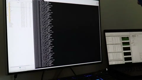 A hacker man writes the white code for an attack. Program a virus with your c Stock Footage 143674935