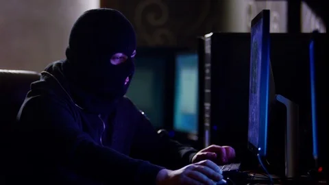 Hacker with mask breaking code. Stock Footage 71920264