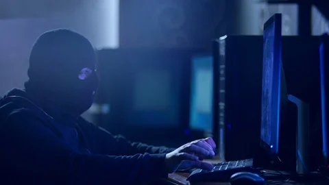 Hacker with mask breaking code. Stock Footage 71920949