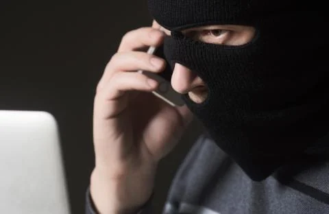 Hacker in a mask Stock Photos