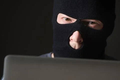 Hacker in a mask Stock Photos
