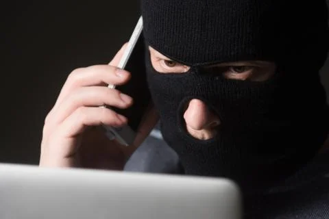 Hacker in a mask Stock Photos