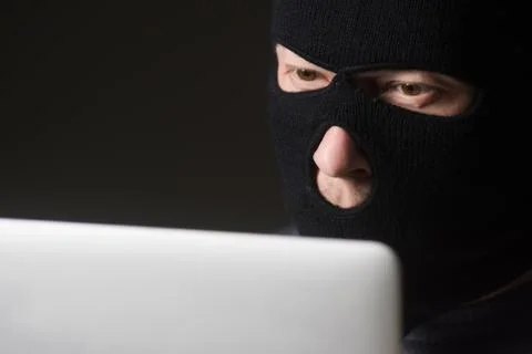 Hacker in a mask Stock Photos