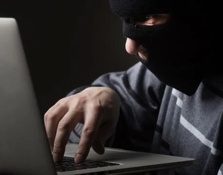 Hacker in a mask Stock Photos