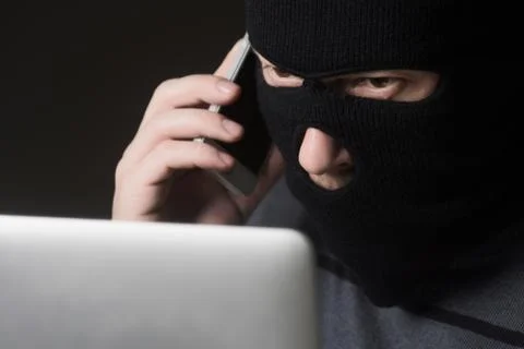 Hacker in a mask Stock Photos