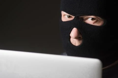 Hacker in a mask Stock Photos