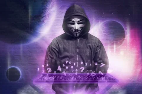 Hacker in mask typing keyboard hacking binary data 写真素材