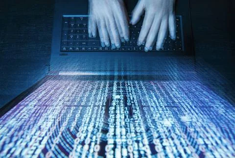 Hacker mit Computer und Matrix in Vogelperspektive Hacker mit Computer und... Stock Photos
