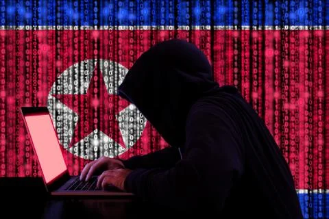 Hacker from north korea at work cybersecurity concept Stock Photos