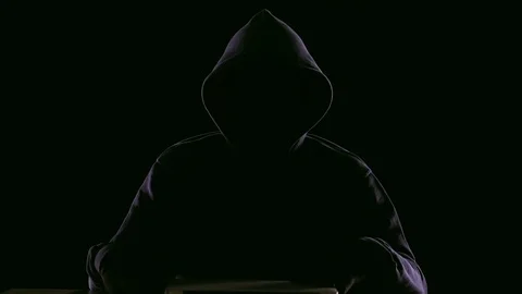 Hacker opening laptop to check virus breaking system codes, stealing data Stock Footage 84117242