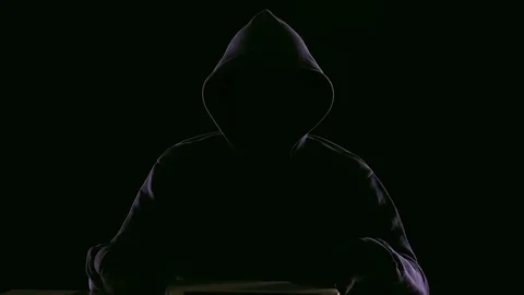 Hacker opening laptop to check virus breaking system codes, stealing data Stock Footage 84135140