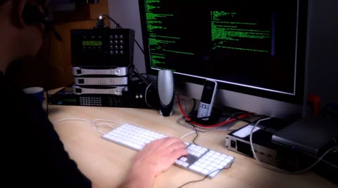 Hacker or programmer with headset on at work 動画素材 35182288