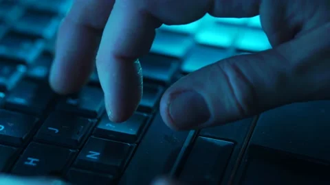 Hacker Or Troll Sinister Man Typing Late At Night On Laptop Stock Footage 148921461