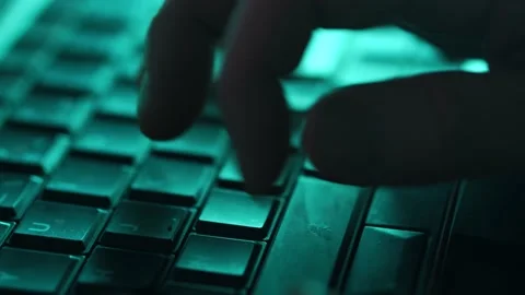 Hacker Or Troll Sinister Man Typing Late At Night On Laptop Stock Footage 148921728