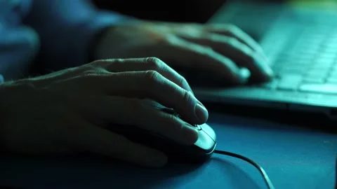Hacker Or Troll Sinister Man Late On Laptop Scrolling With Mouse Stock Footage 148924765
