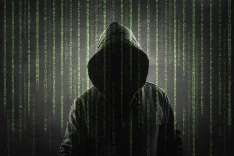 Hacker over a screen with binary code 库存照片