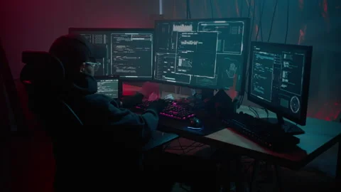 Hacker with pc committing crime during night at basement Video stock 257381185