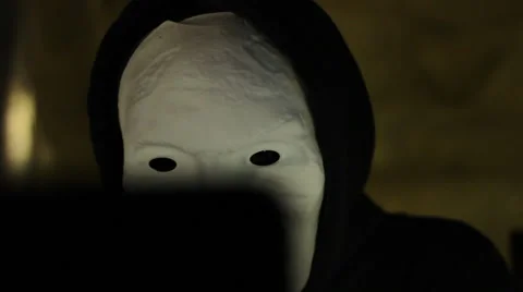 Hacker peering at screen Stock Footage 43712990