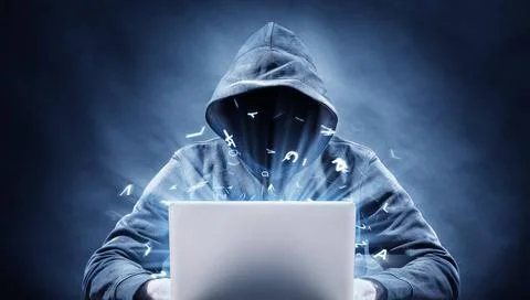 Hacker picture of a hacker on a computer Copyright: xZoonar.com/frankxpete... Stock Photos