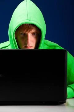 Hacker portrait hacker. Young man with laptop is looking at screen ,model ... Stock-Fotos