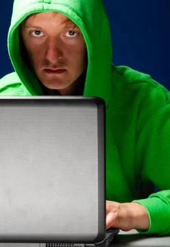 Hacker portrait hacker. Young man with laptop is looking at camera ,model ... Stock-Fotos