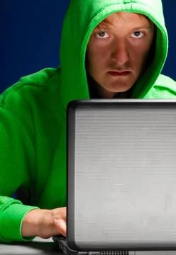 Hacker portrait hacker. Young man with laptop is looking at camera ,model ... Stock-Fotos