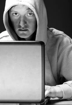 Hacker portrait hacker. Young man with laptop is looking at camera ,model ... Stock-Fotos