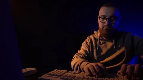 Hacker of Programmer From 1990's in Front of Monitor of Desktop PC Typing on Stock Footage 301695928