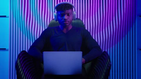 Hacker programmer computer worker gamer African American man in headphones male Stock Footage 283349004