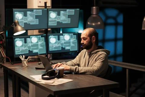Hacker programmer hacking system at office 스톡 사진