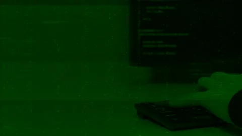 Hacker programmer hands close up typing code on keyboard in green terminal Video stock 114994326