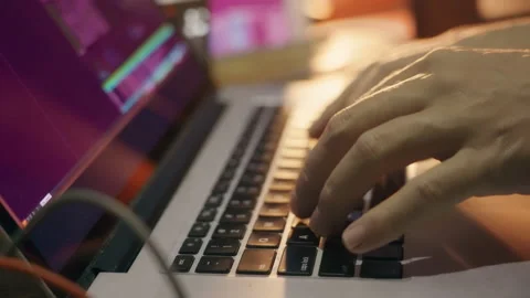 The hacker programmer starts working. A person stretches his fingers and turns Stock Footage 158760573