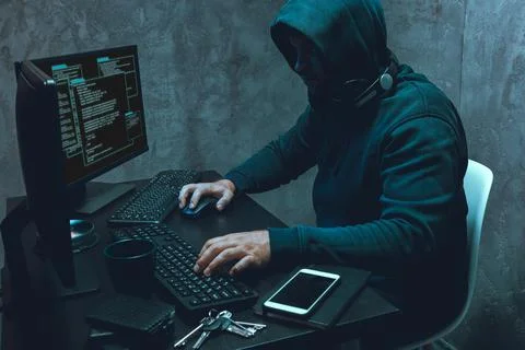 Hacker programmer using computer in dark room 스톡 사진