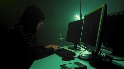 Hacker programmer is working on computer in cyber security center filled with Stock Footage 111487114