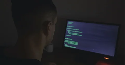 Hacker programmer is working on computer writing the code Stock Footage 95680264