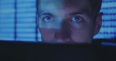 Hacker programmer is working on computer writing code in cyber security center Stock Footage 95923631