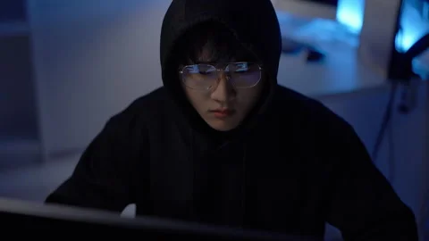 Hacker programming malicious code for cyberattack Stock Footage 313825047