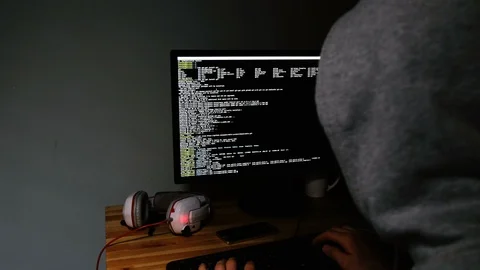 Hacker programs in the command line, the monitor glows in the dark, 4k 스톡 동영상 99328022