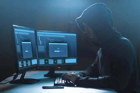 Hacker with progress loading bar on computers 写真素材