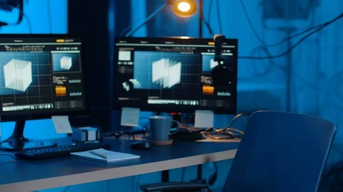 Hacker putting headphones on getting to computers Stock Footage 107379724