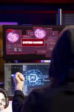 Hacker receiving system hacked message after attacking PCs using AI malware Stock Photos