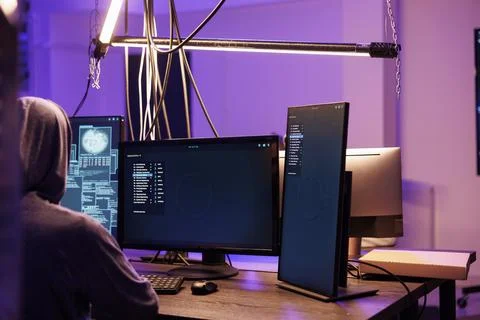 Hacker running malware on screen Stock Photos