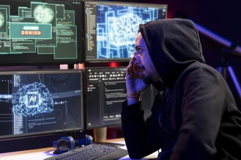 Hacker sad after seeing access denied popup on PC, trying to breach systems Stock Photos